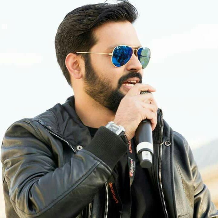 Vineet Sharma speaking into a microphone
